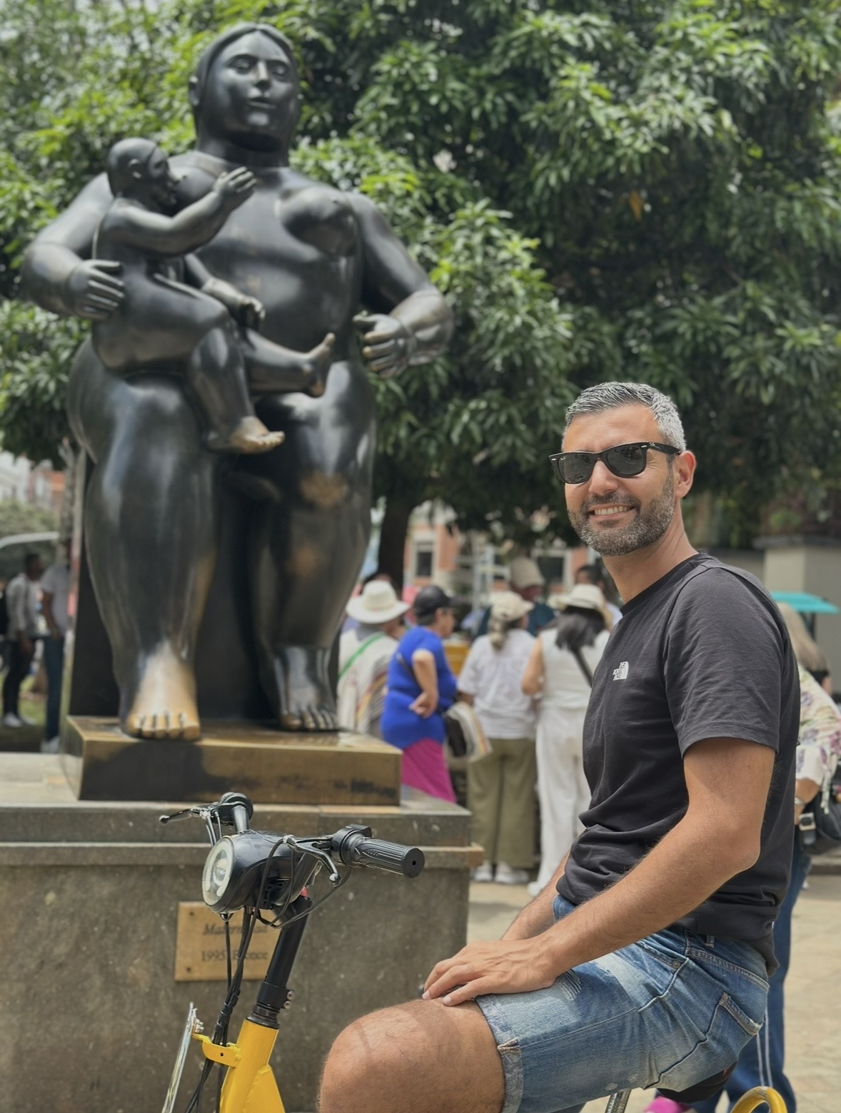 Visitor next to a Botero sculpture outside the Museo de Antioquia