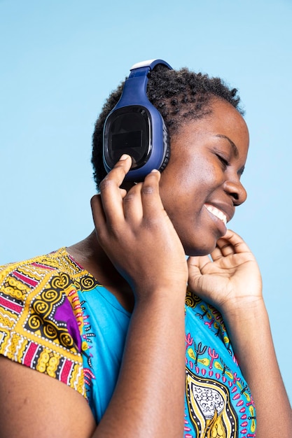 Person immersed in listening to an audio story with headphones