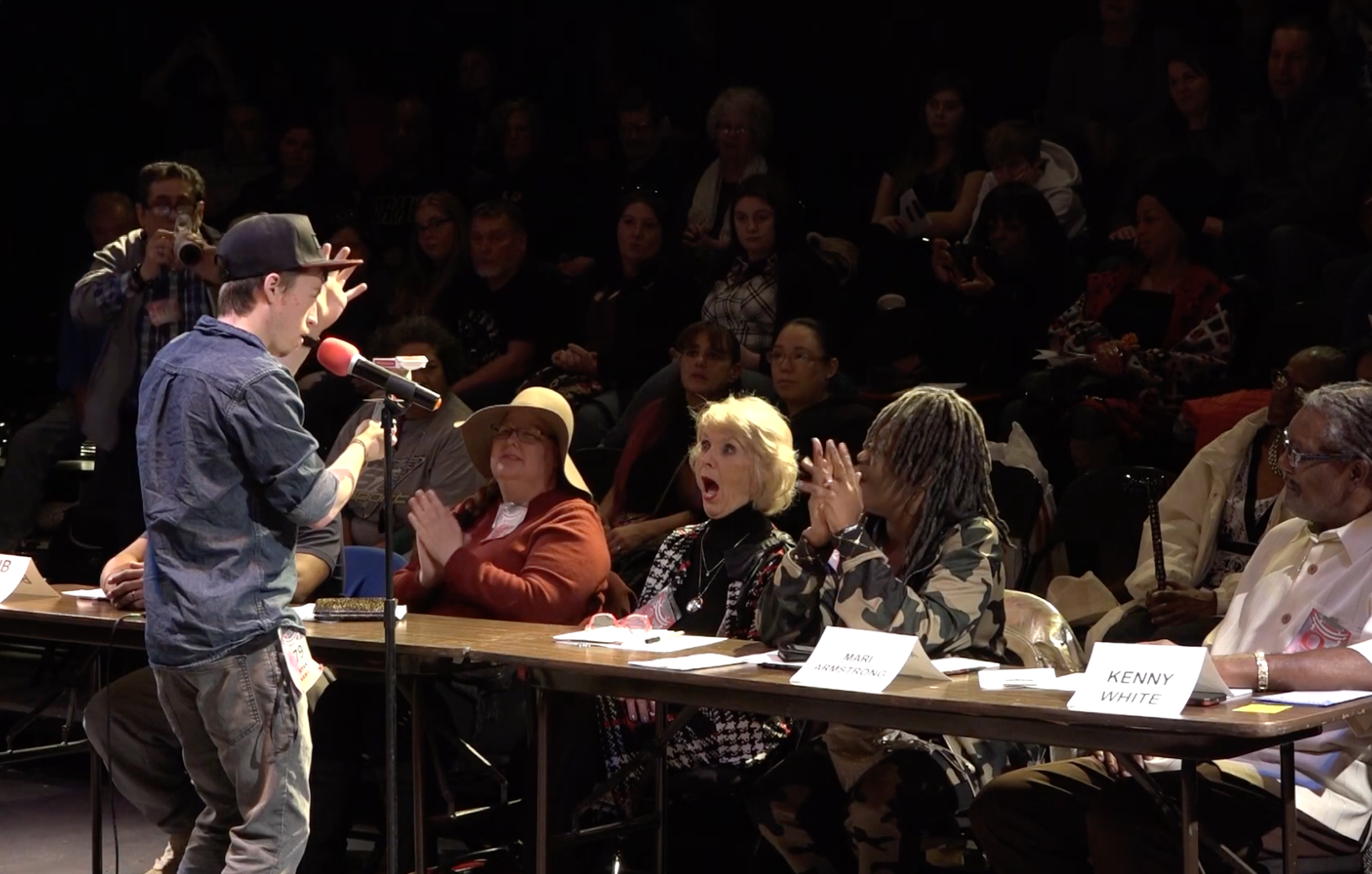 Ryan Daniels performing with shocked audience