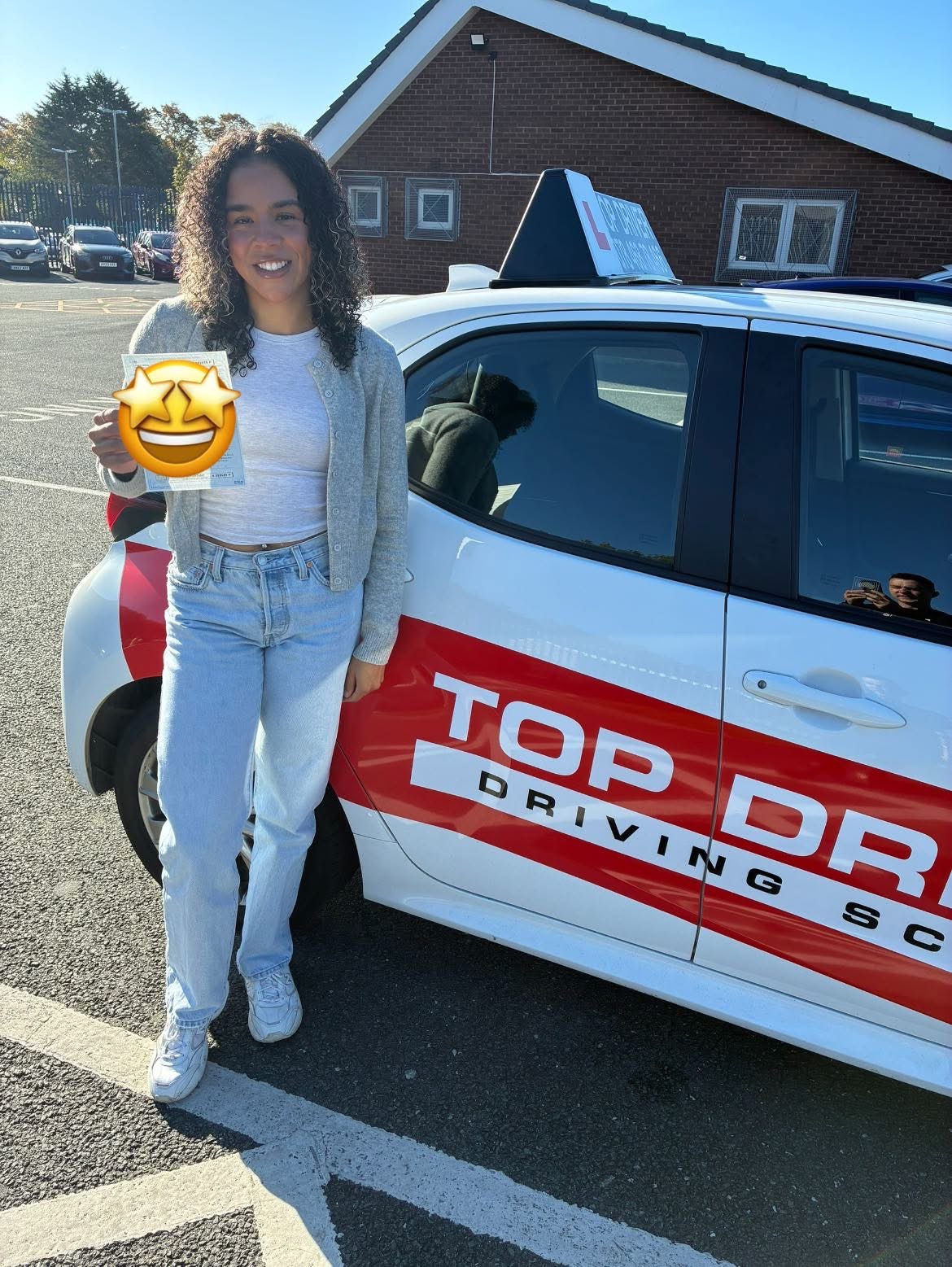Student celebrating test pass with Top Driver