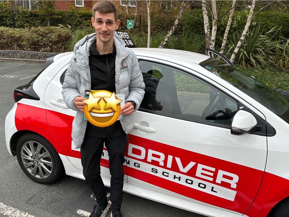 Student celebrating pass with Top Driver