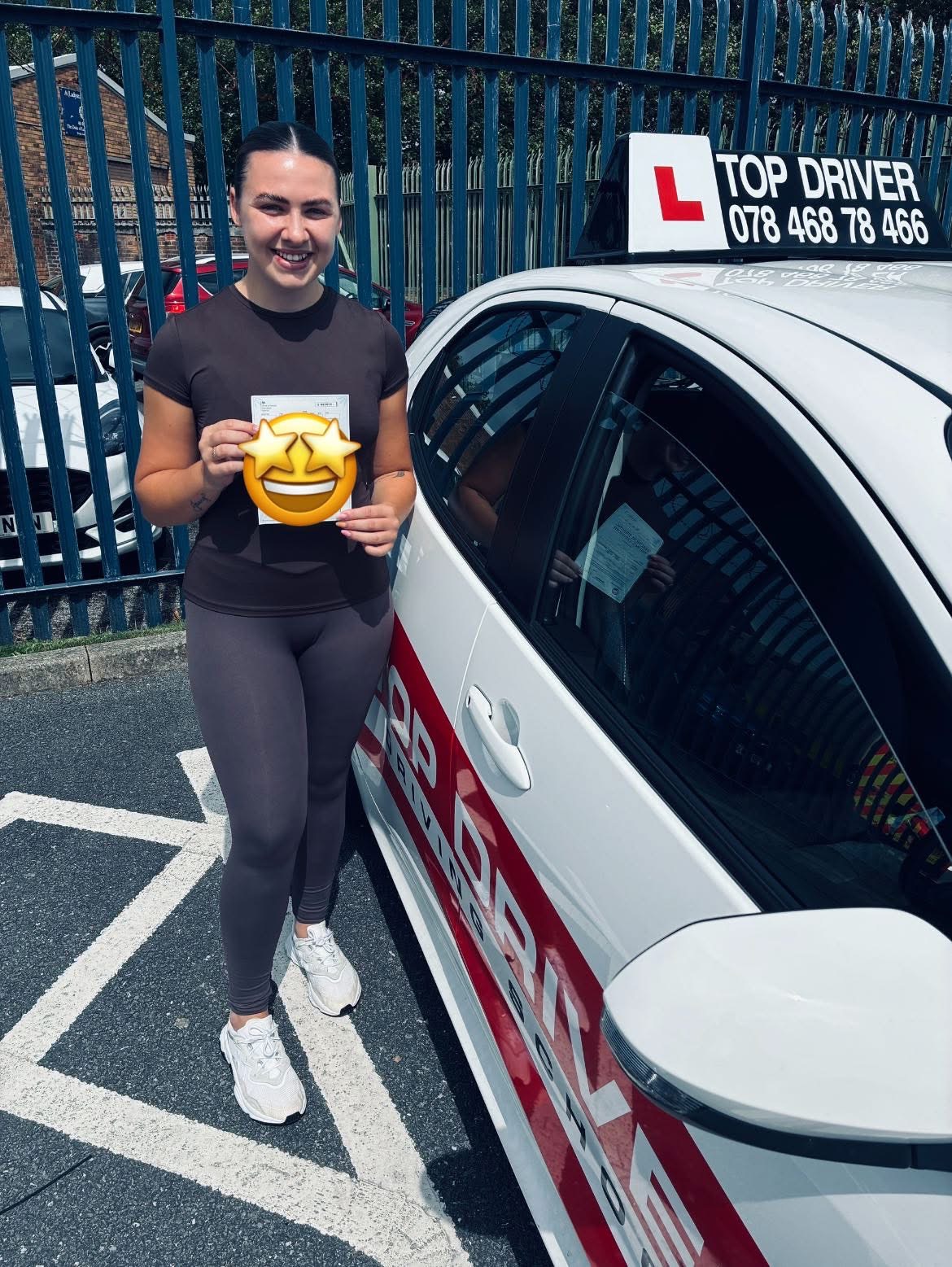 Student with pass certificate and Top Driver car