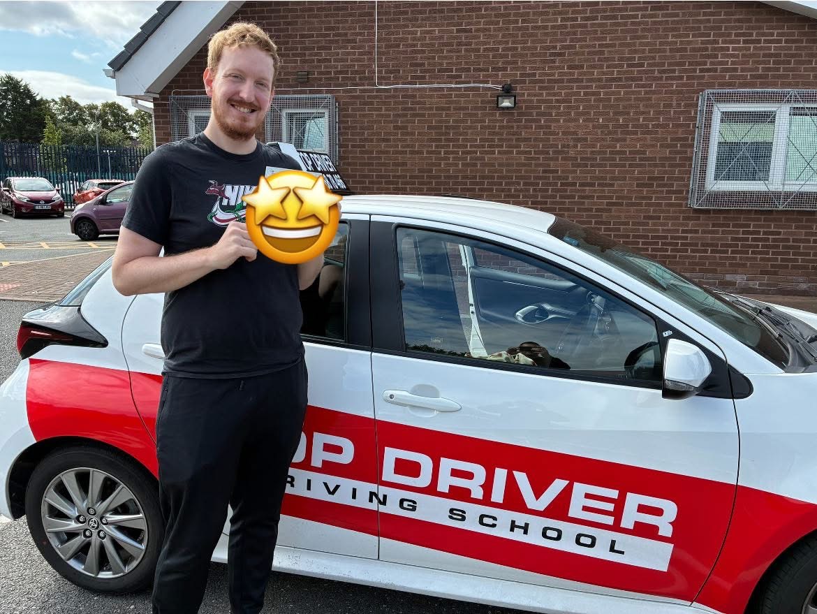 Male student celebrating driving test pass