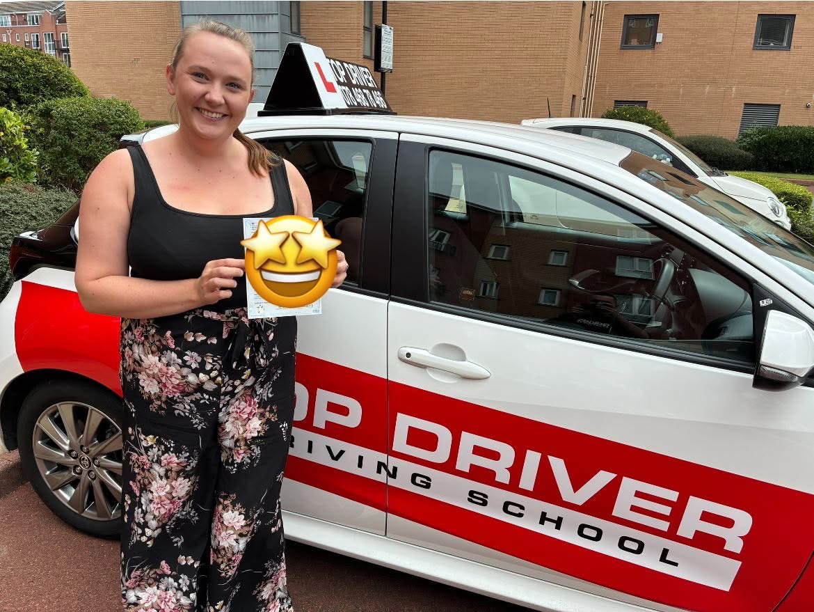 Proud student with driving pass certificate
