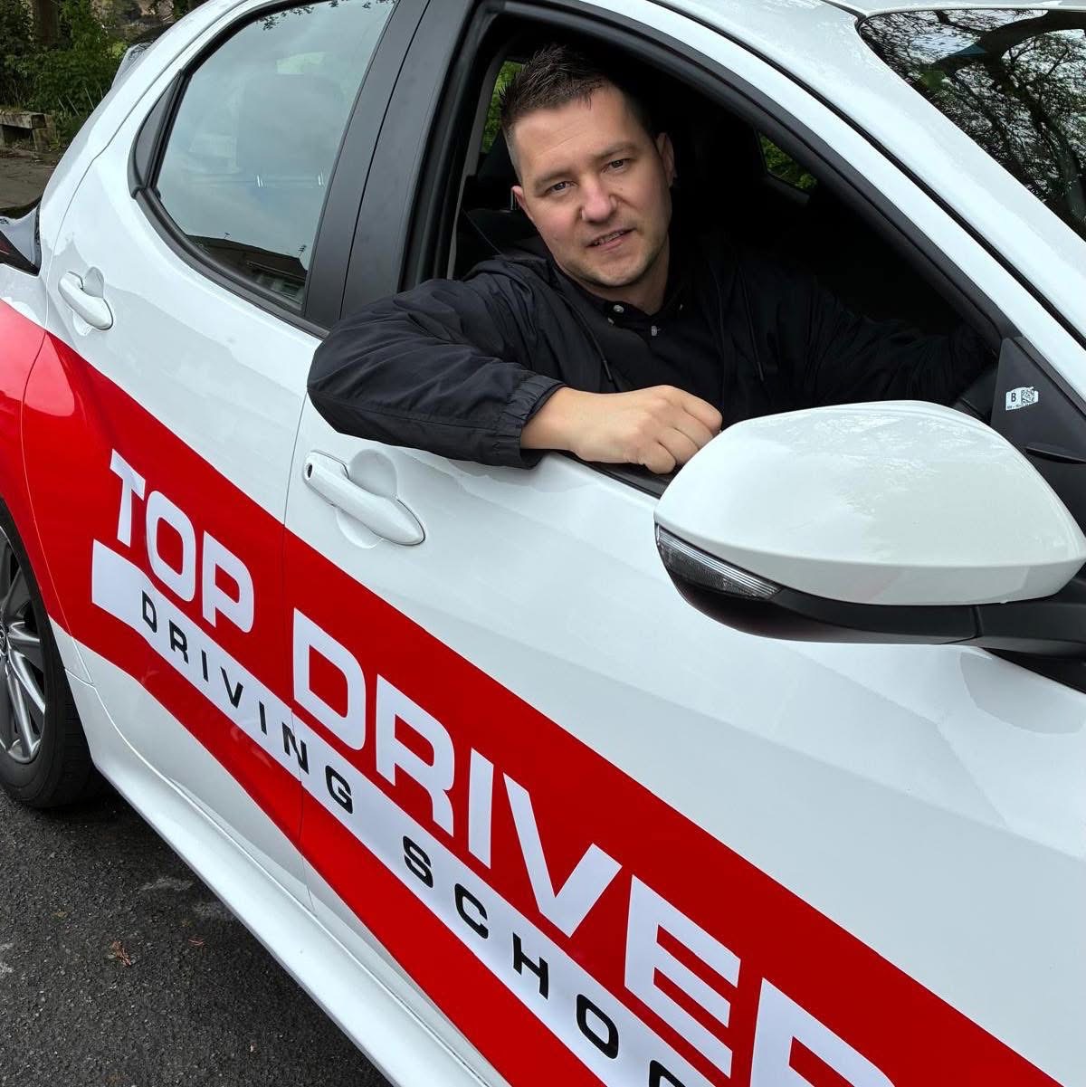 Happy student celebrating driving test pass