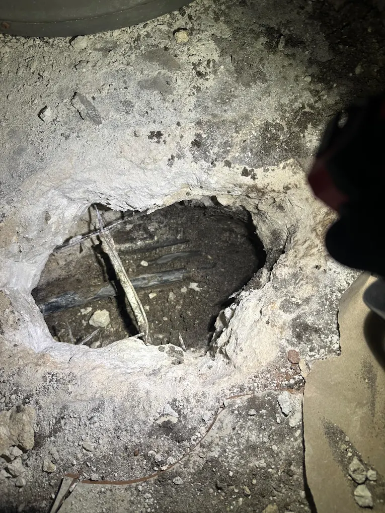 Under-slab pipe inspection revealing damaged drain line