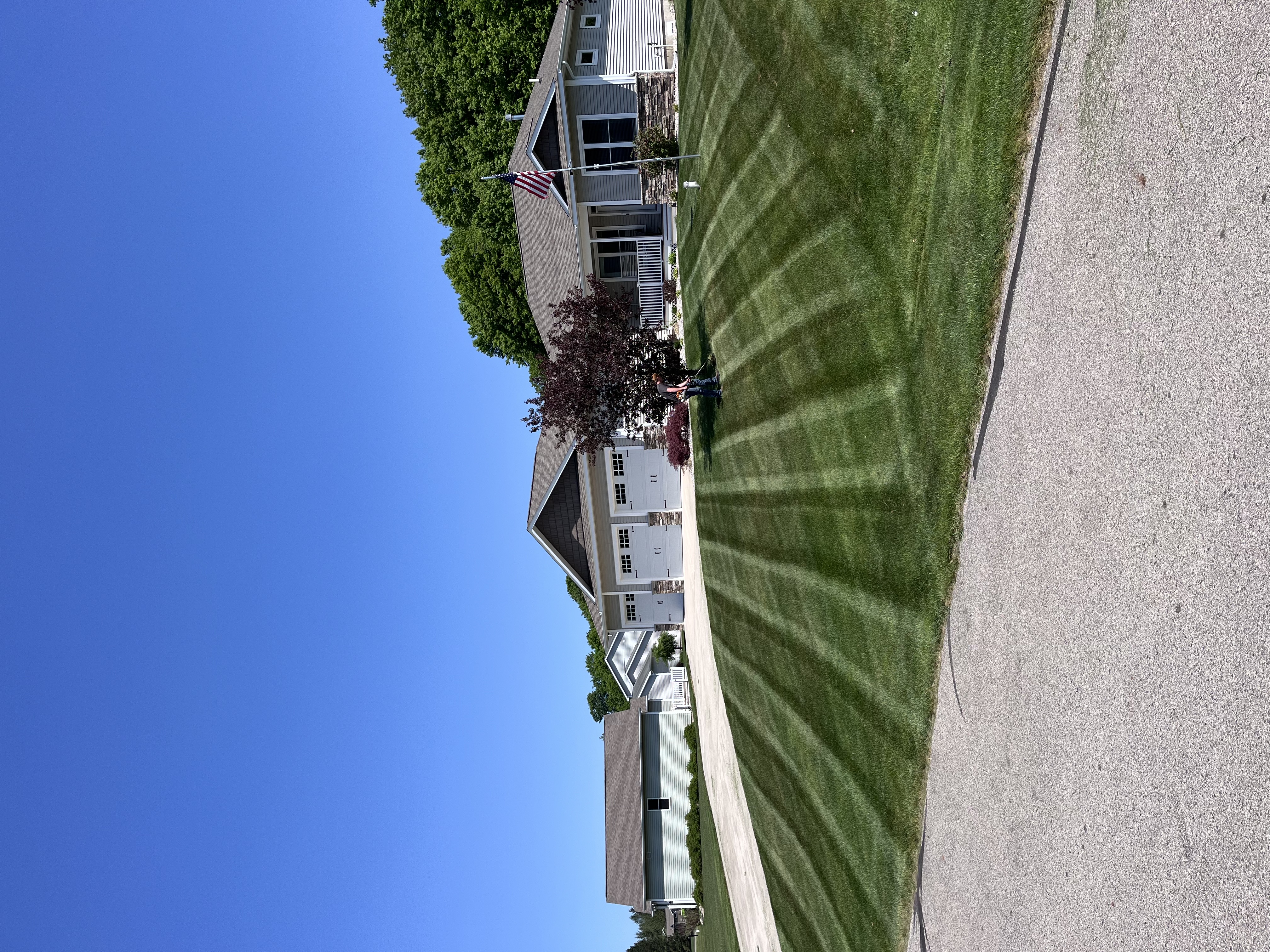 Front lawn with crisp mowing stripes, Crosscut Lawn Care