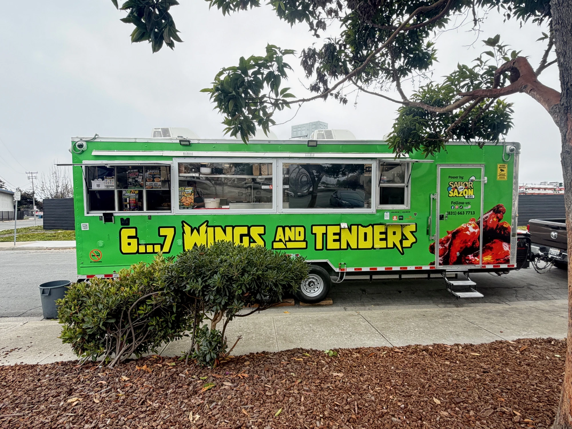 67 Wings & Tenders neon green food truck