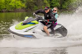 Couple riding green Yamaha
