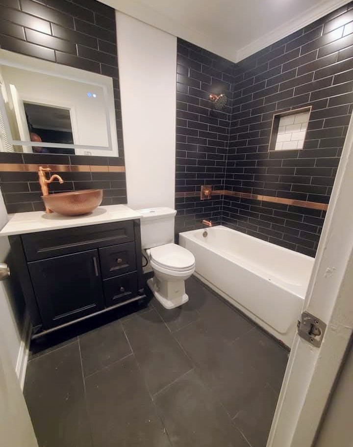 Luxury Bathroom with Dark Subway Tile