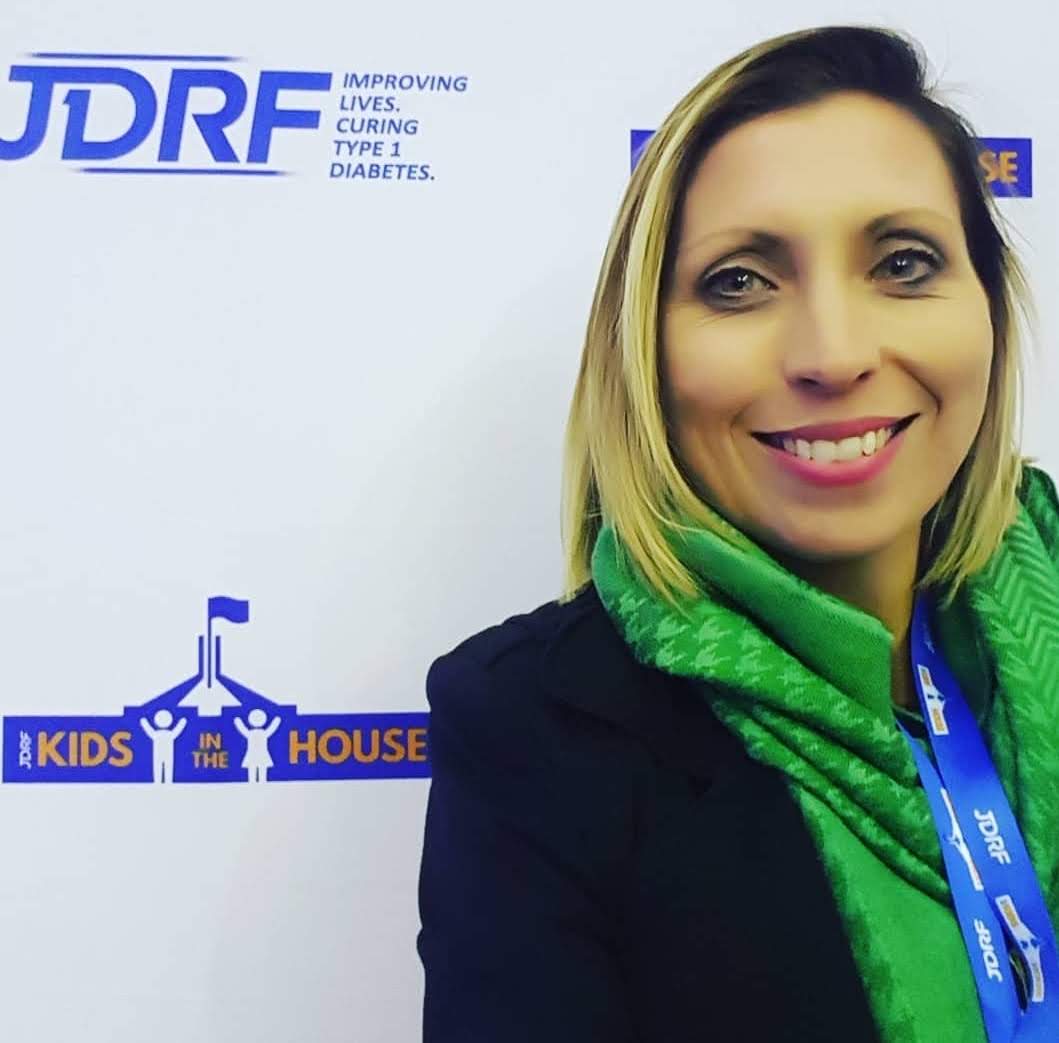 Louise in a green scarf at JDRF Kids in the House, Parliament House