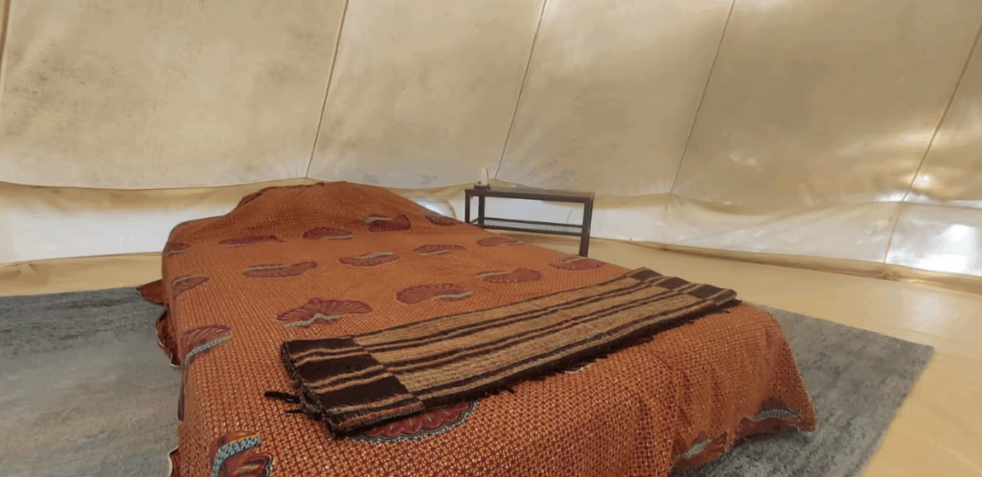 Bed with kantha throw