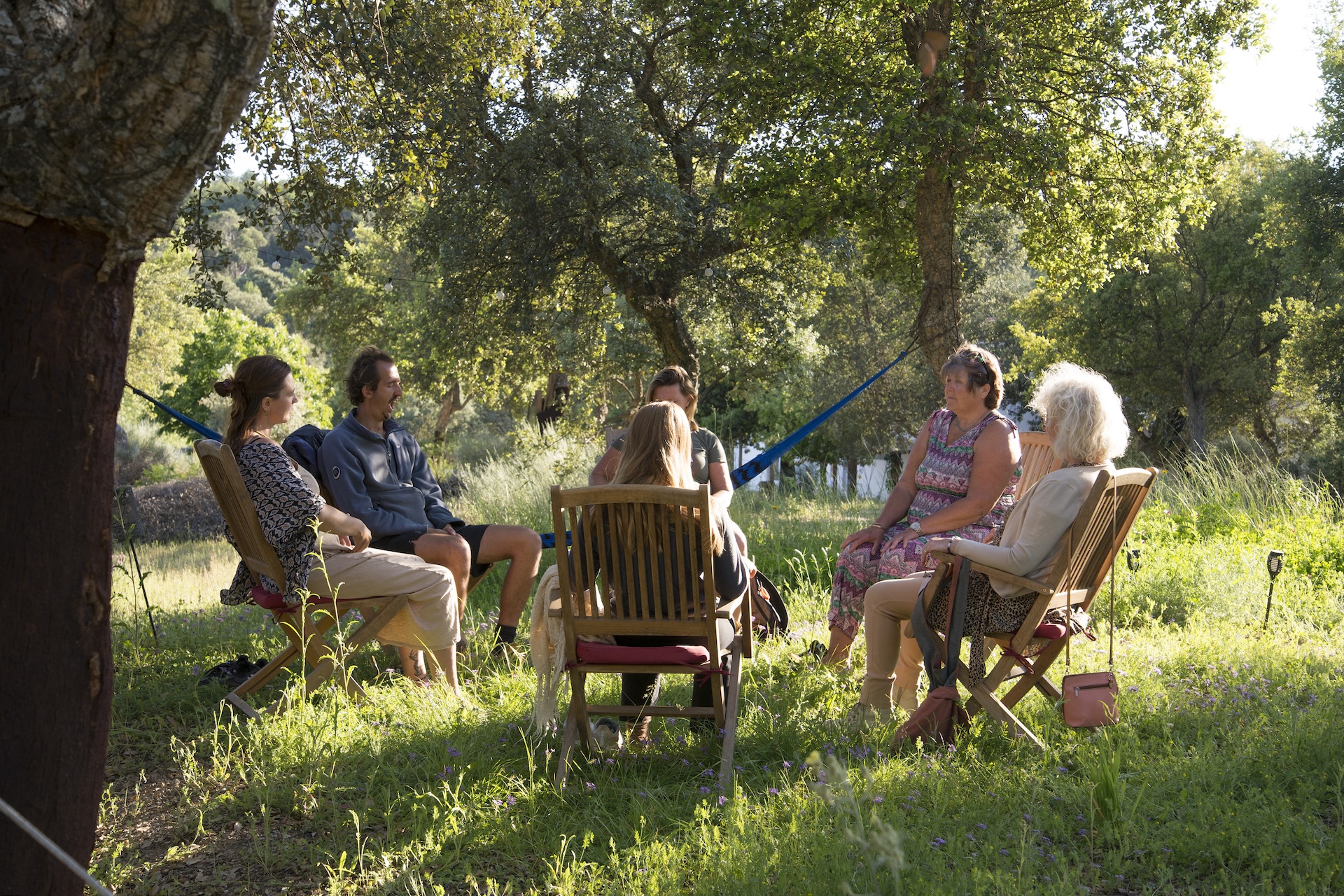 A small group seated together at Limiar during a retreat gathering
