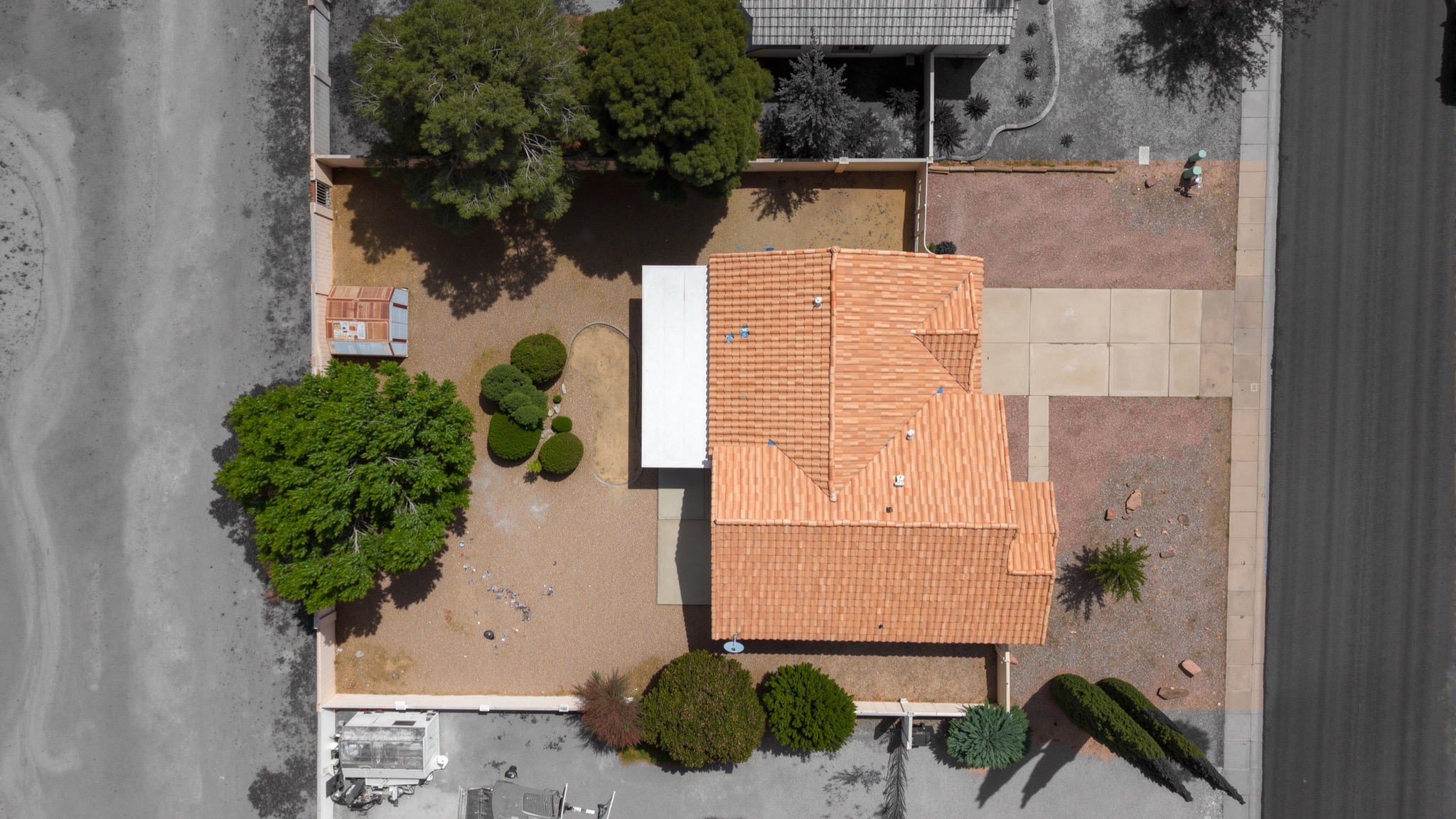 Top-down aerial view of property with tile roof