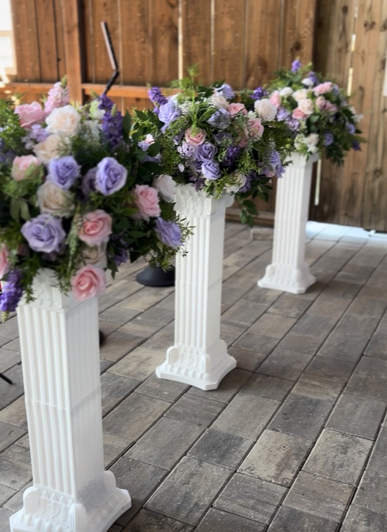 Hem of Grace Events wedding floral arrangements white columns Florida planner