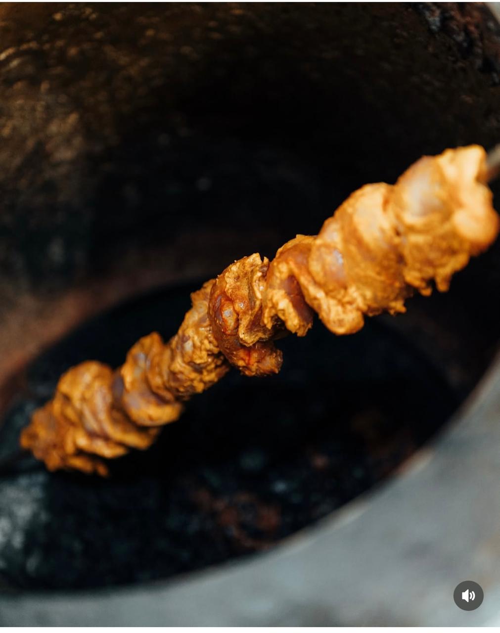 Tandoori skewer over the charcoal pit