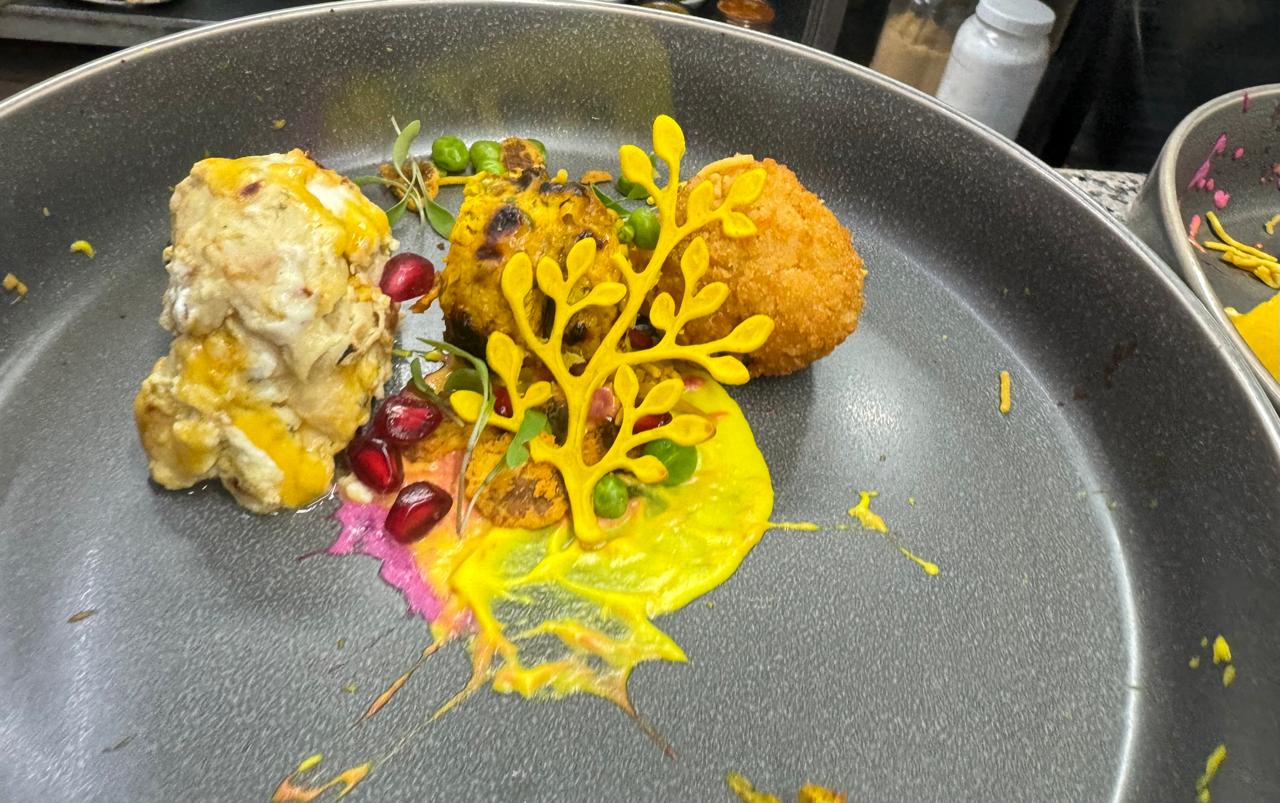 Plated kebabs with yellow tuile leaf garnish