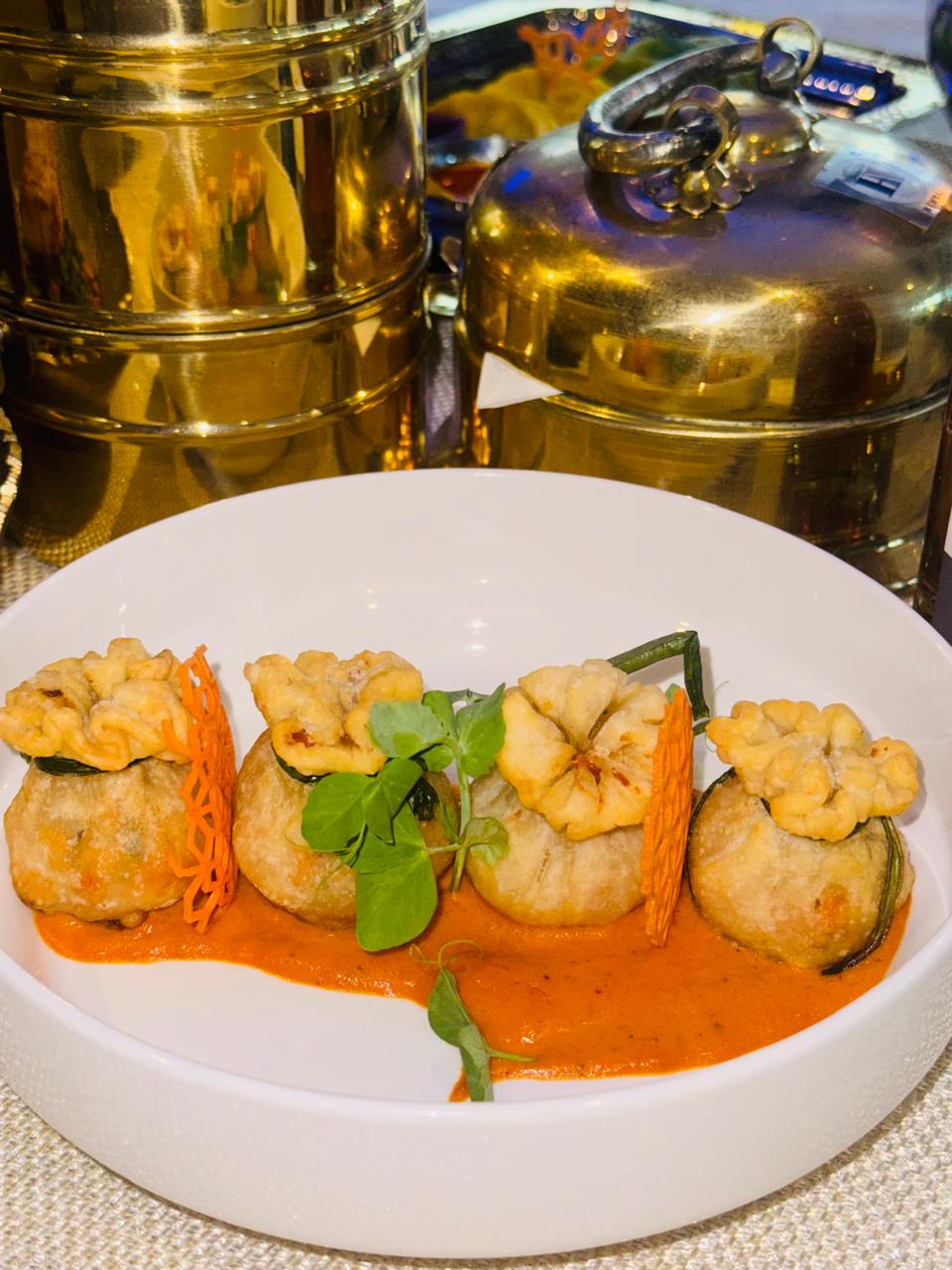Potli kebabs plated with brass tiffin
