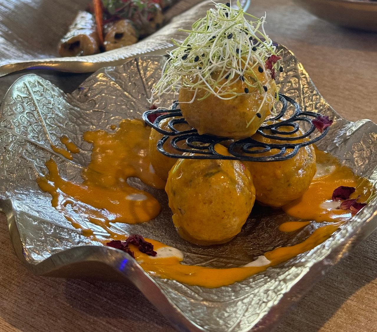 Saffron kofta tower with squid ink tuile