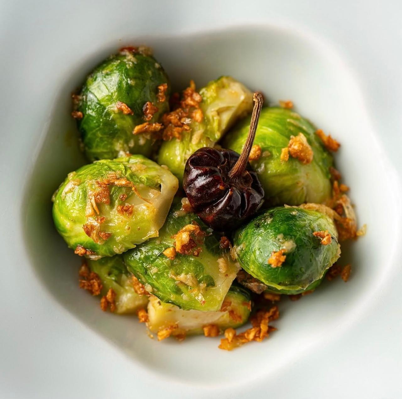 Crispy Brussels sprouts with garlic chips and chilli
