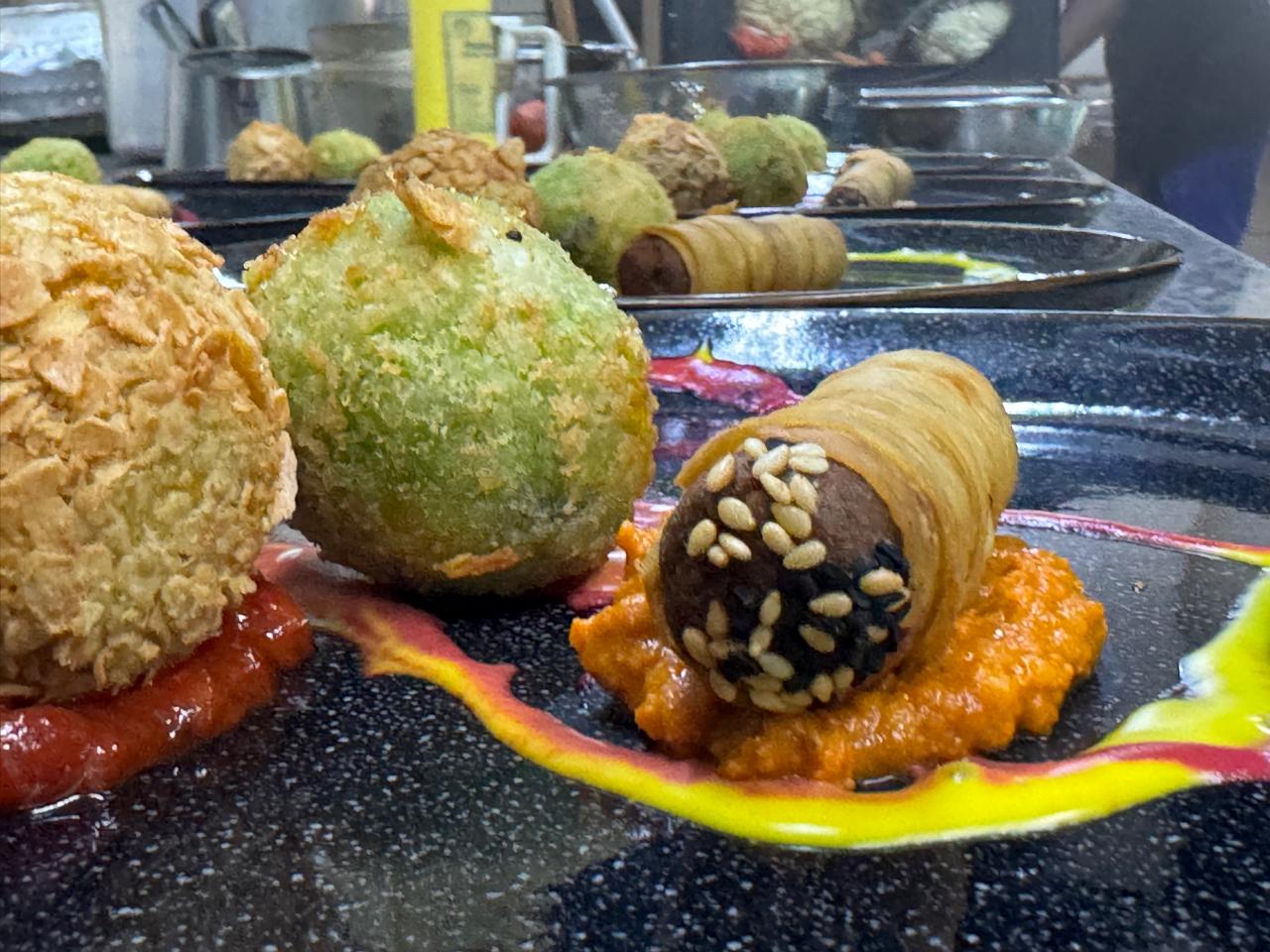 Trio of crusted appetizers with sauces