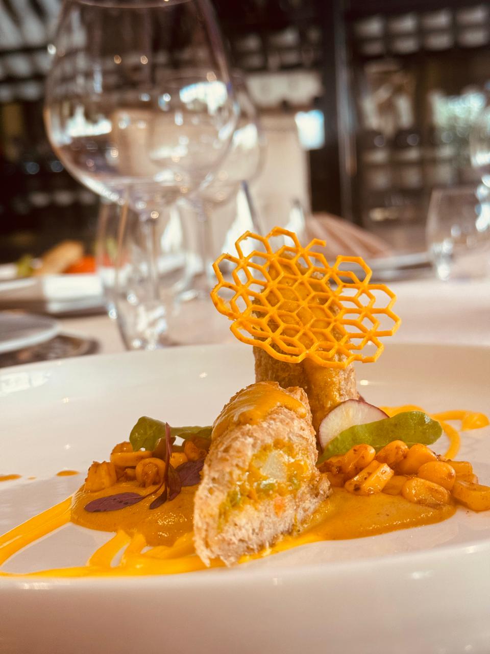 Plated dish with orange honeycomb tuile