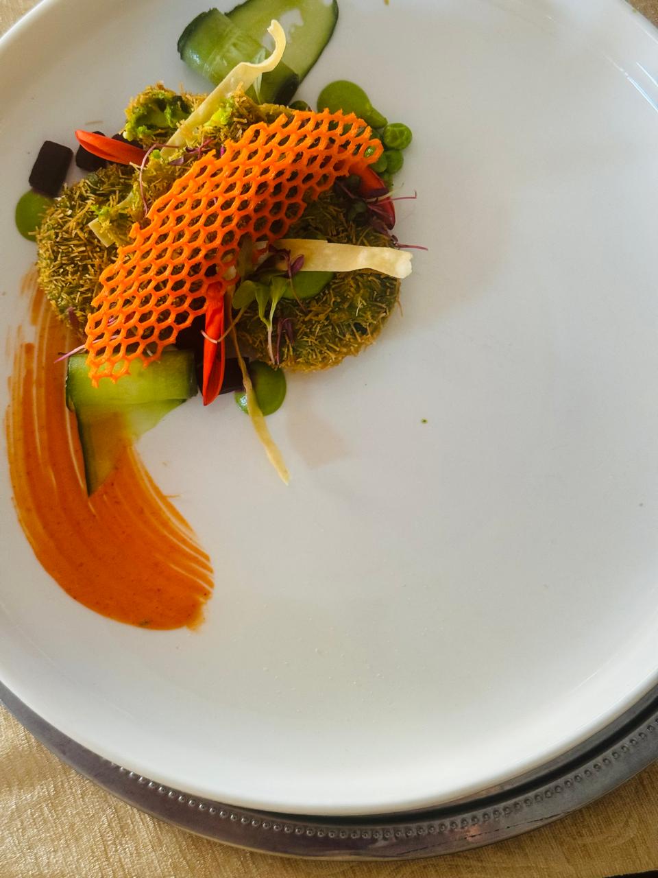 Hara kebab patty with carrot tuile and tomato sauce