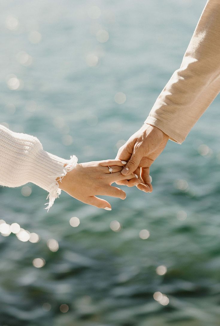Holding hands by the sea