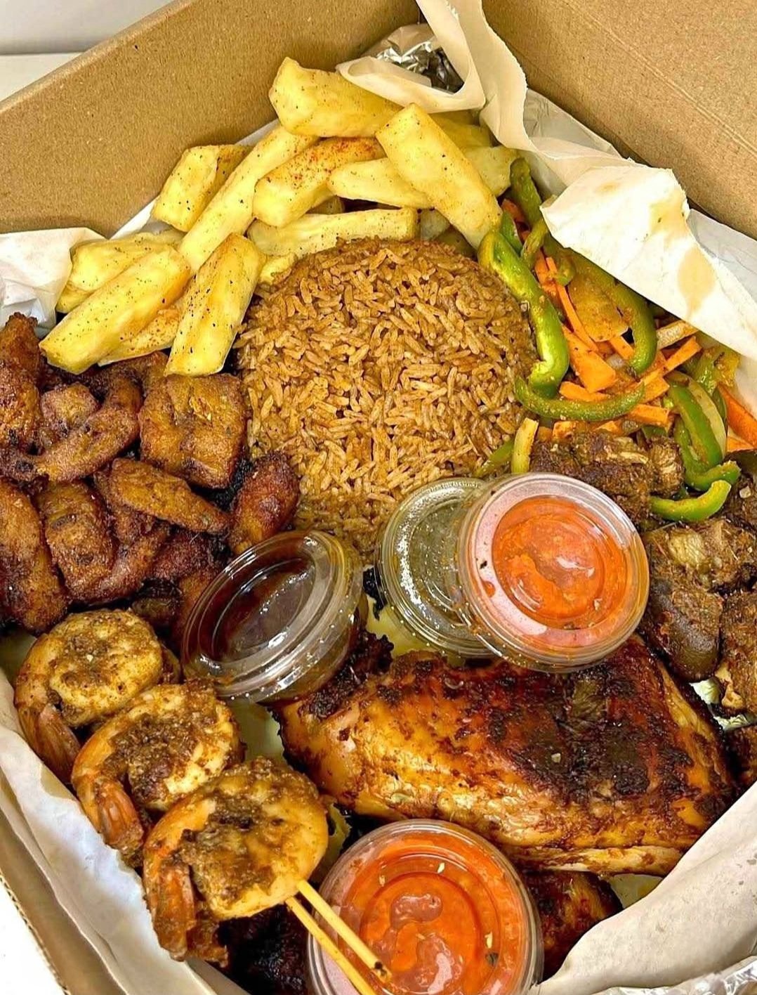 Succulent Ghana Jollof Rice - 818 Food Truck Stop at 818 Coshocton Ave, Mt Vernon