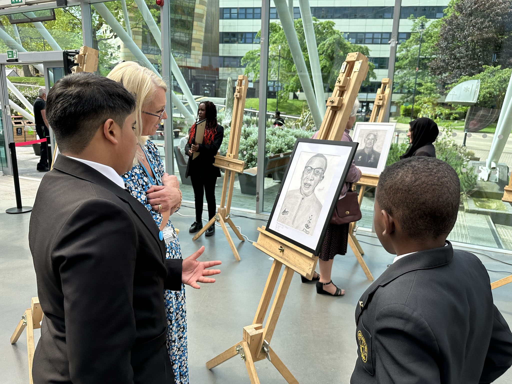 Visitors viewing student artwork