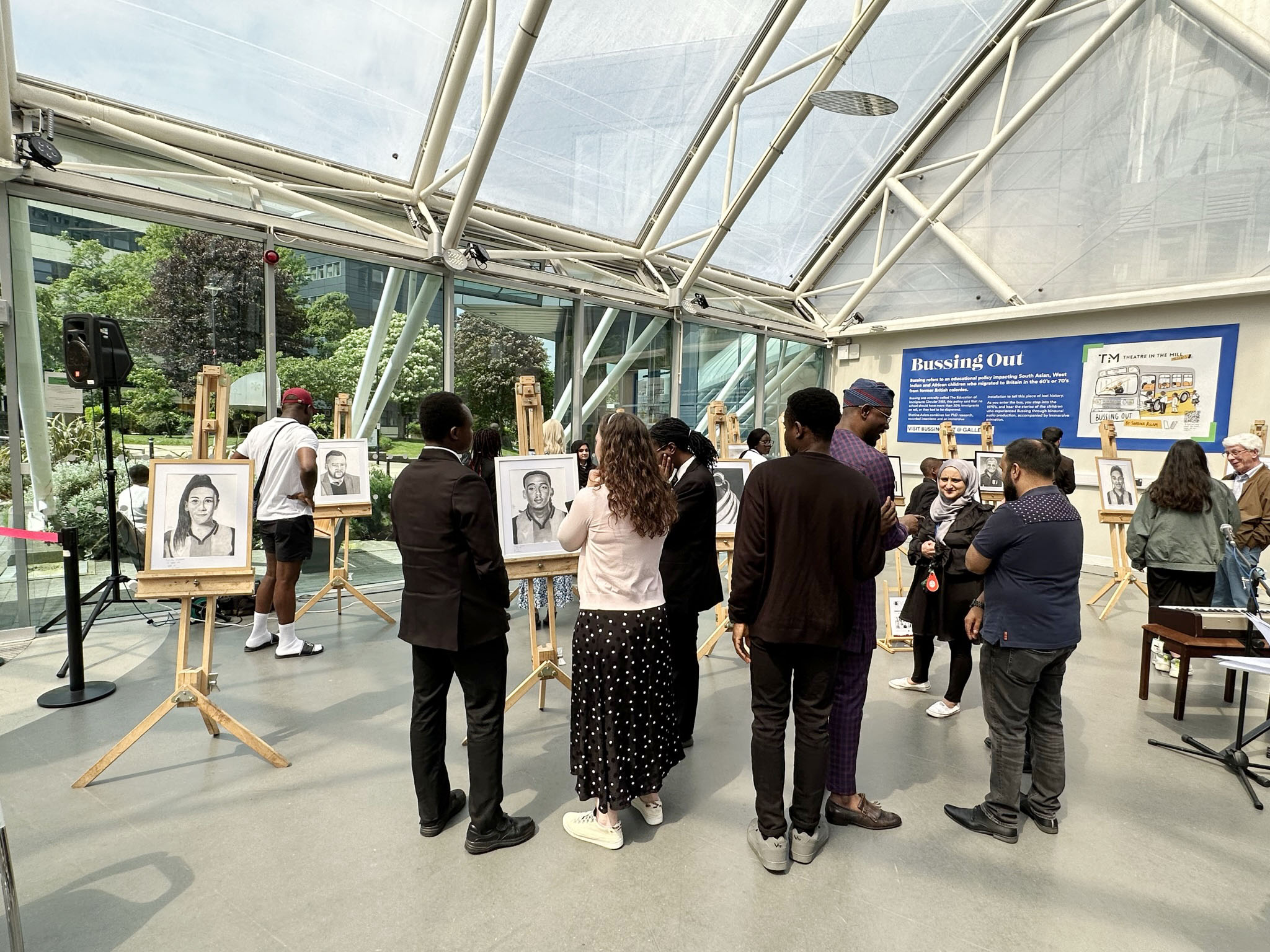 Gallery visitors viewing portraits