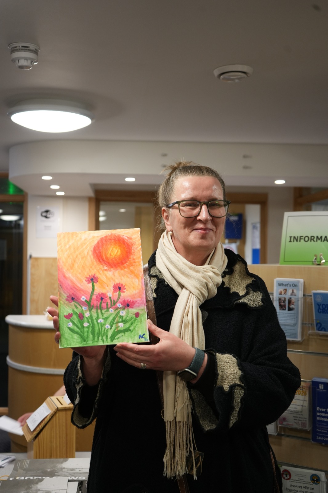 Participant showing sunset flowers painting