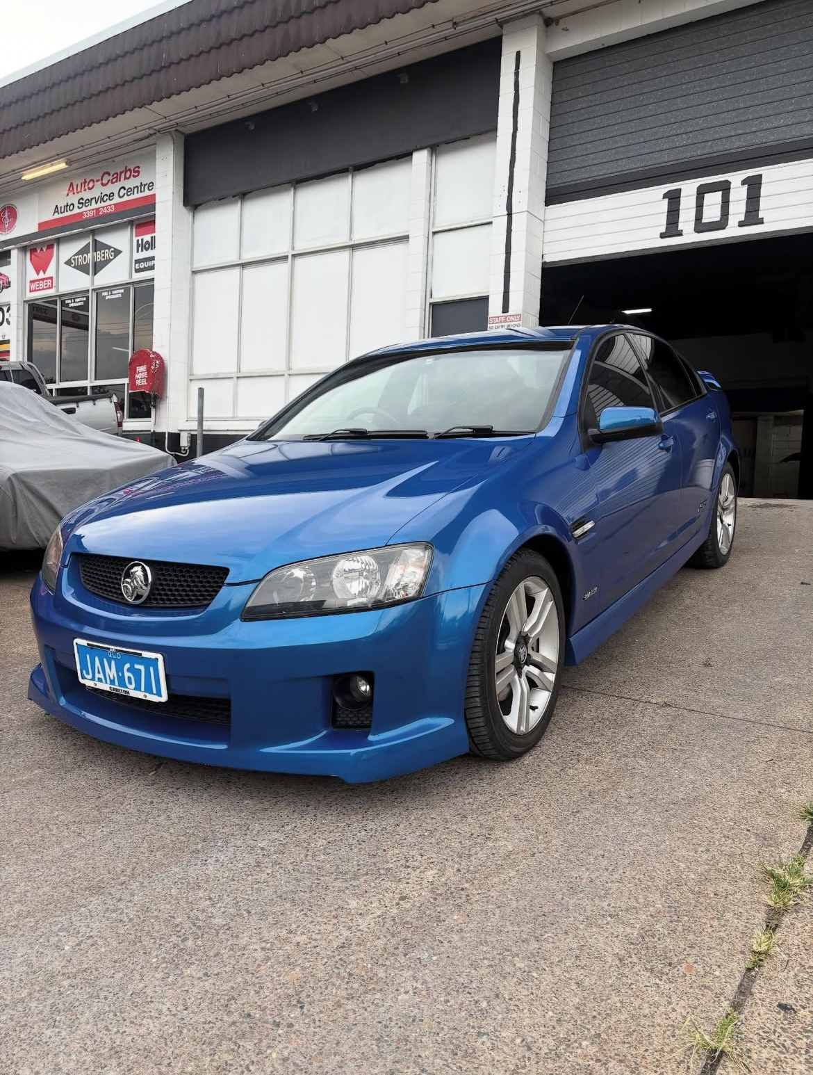 Blue Holden Commodore VE at 101 Norman St shop