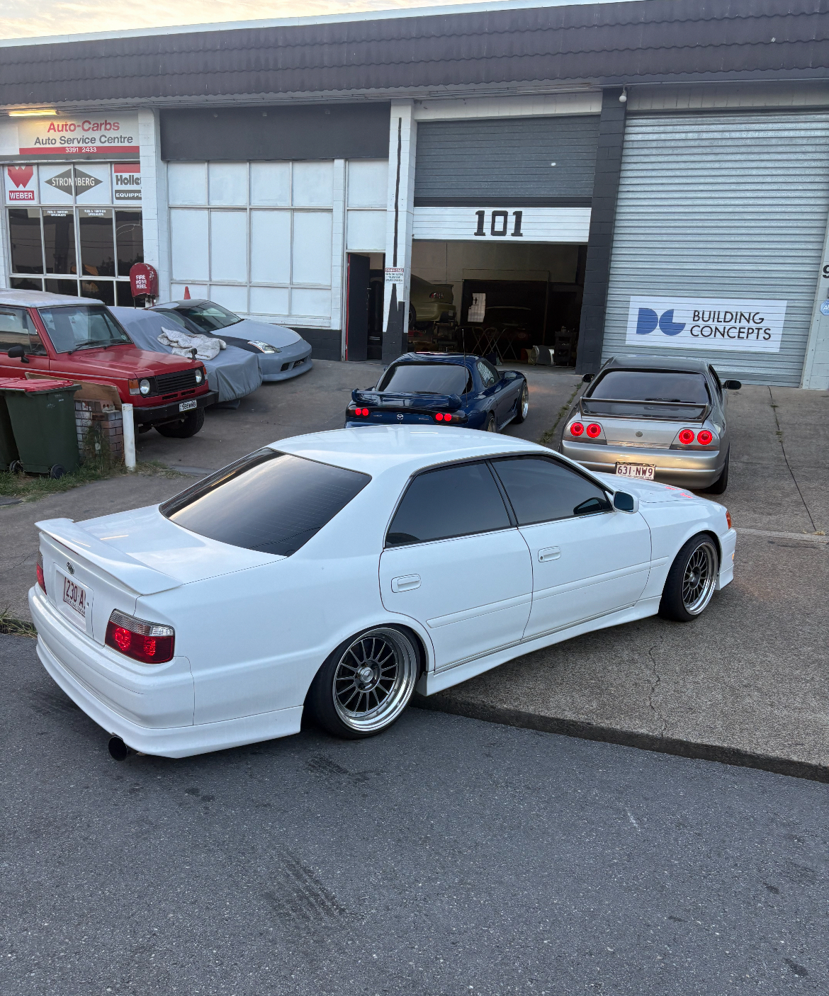 Toyota Chaser JZX100 slammed on BBS wheels outside 101 Norman St shop