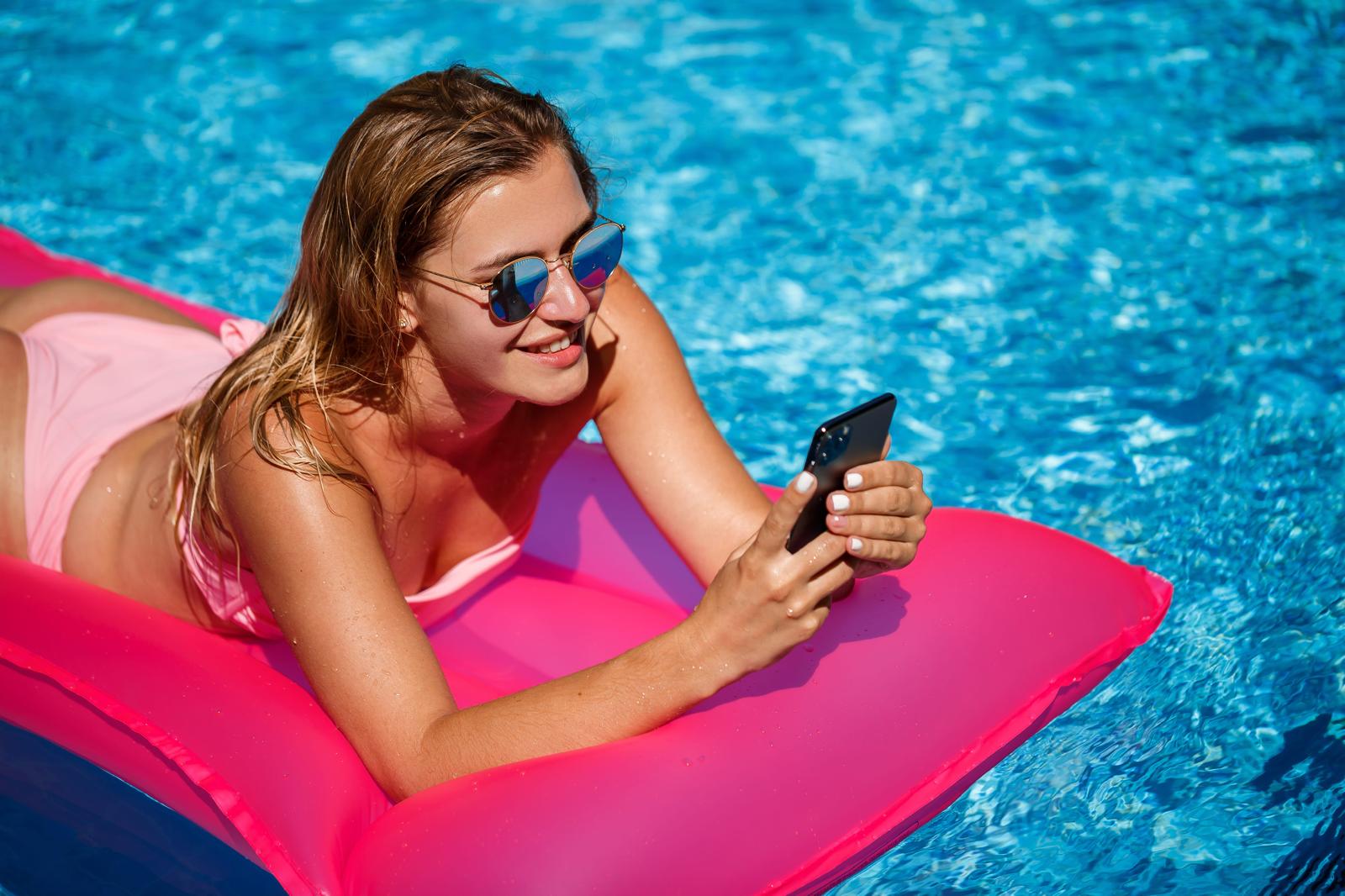 Professional woman with smartphone - eSIM connectivity