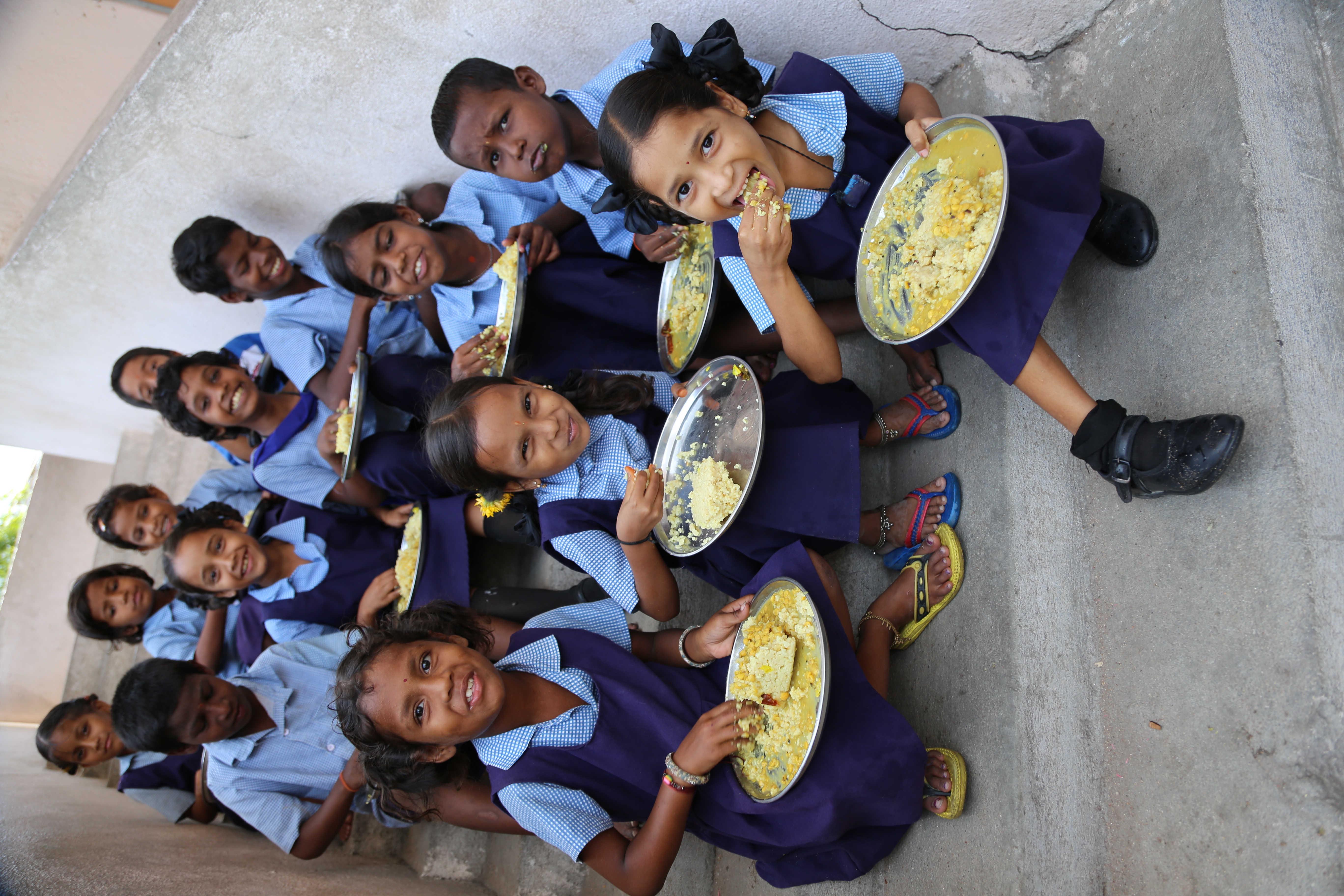 Children enjoying mid-day meals