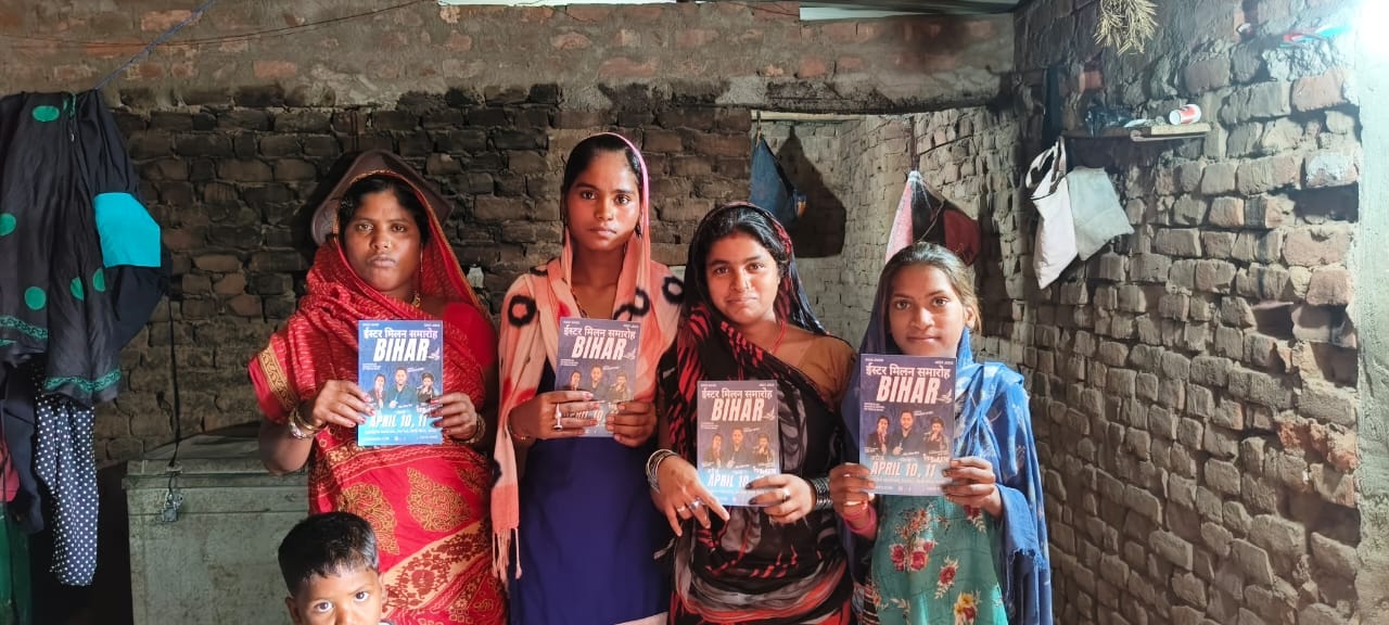 Bihar community member holding revival invitation flyer 4