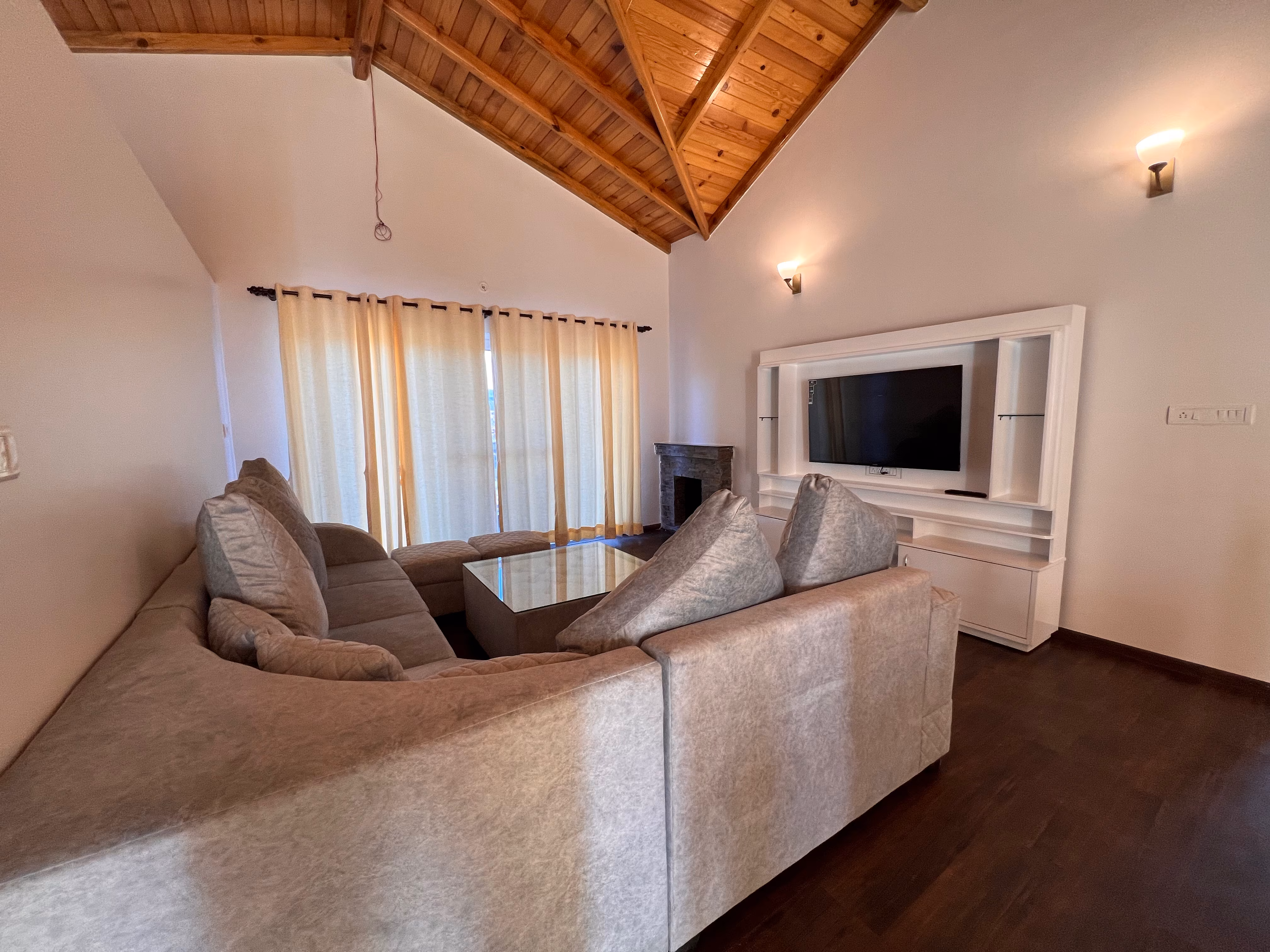 Banpravas — the living room, vaulted wooden ceiling and afternoon light