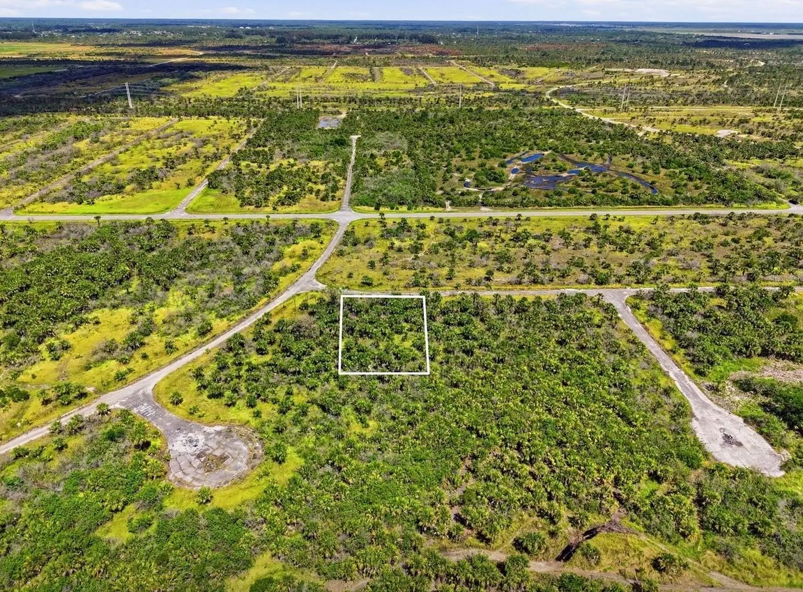 Aerial view of Palm Bay's Compound area — Port Malabar Units 51, 52, and 53 — showing platted roads and undeveloped parcels stretching across thousands of acres