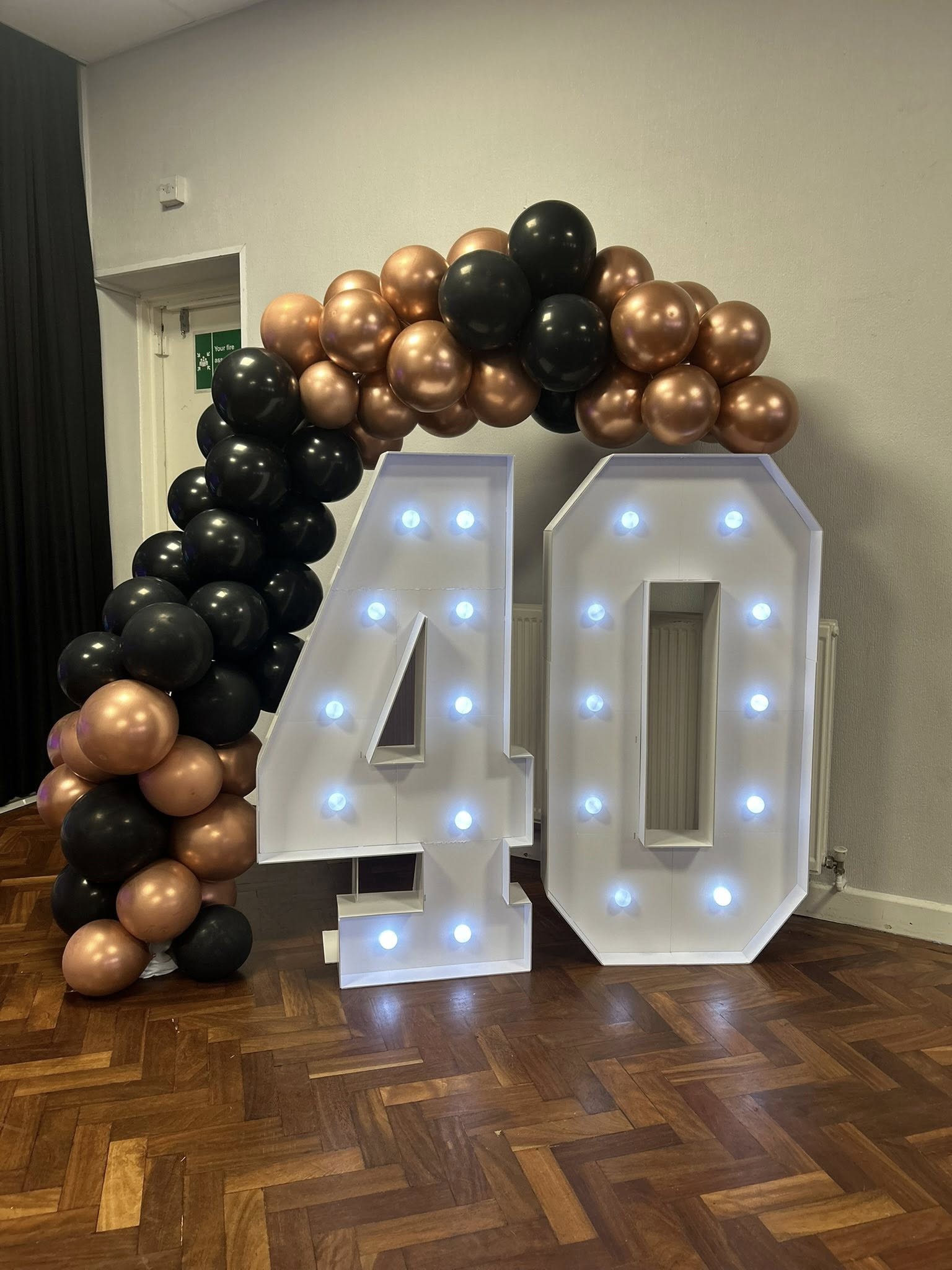 Light-up 40 with copper & black balloons