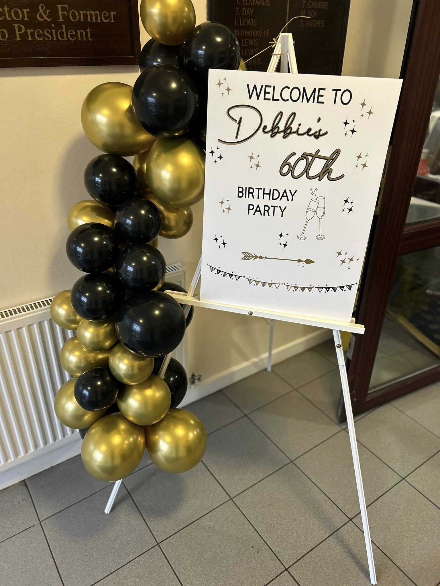 Debbie's 60th personalised welcome sign with gold balloons