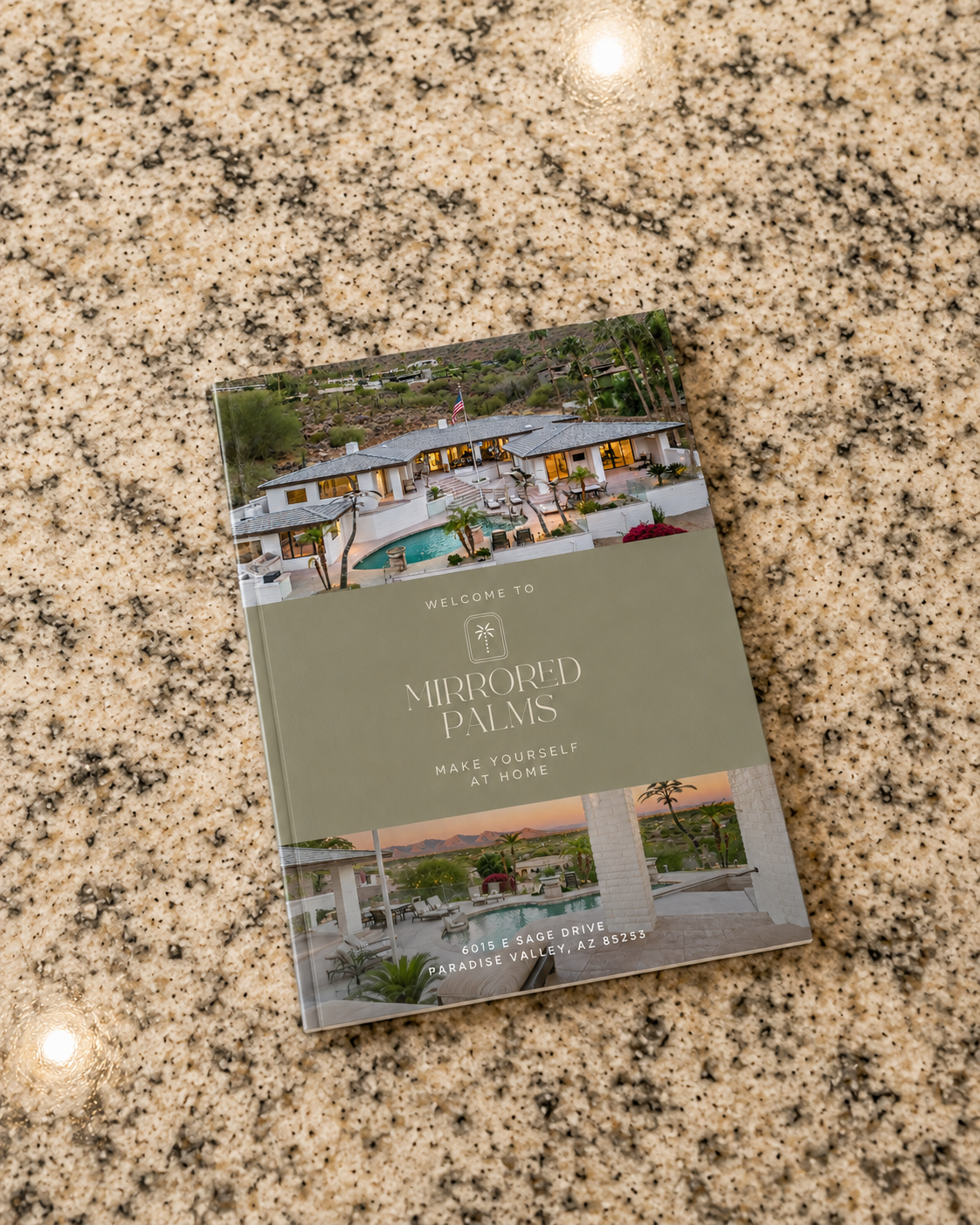 Mirrored Palms — welcome housebook on the kitchen counter