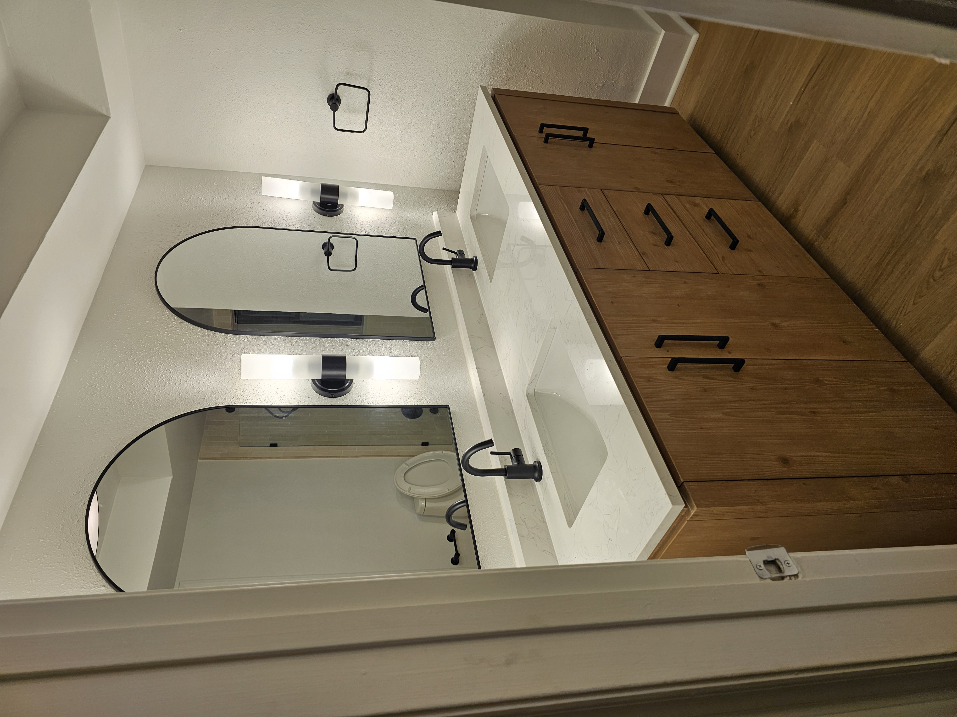 Modern double vanity with arched mirrors