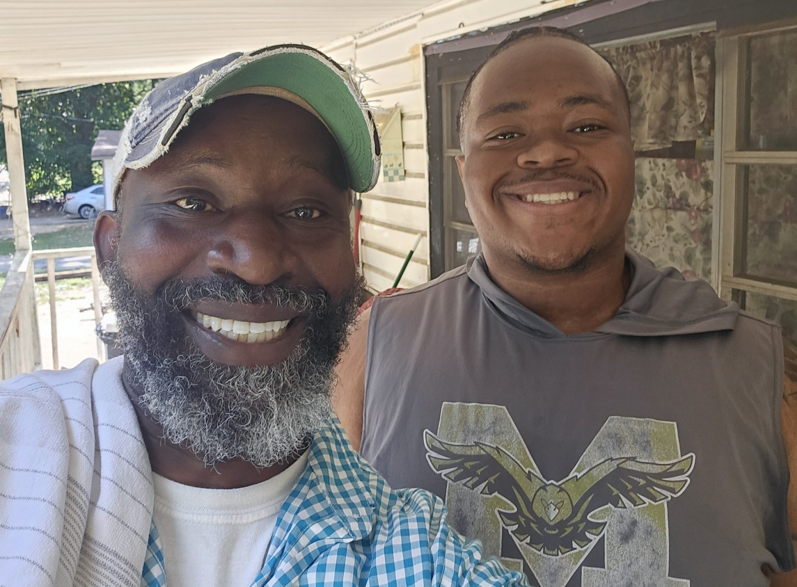 Vic Appiah with Freddie Compton on his porch in Blacksville — a moment from the June 29 to July 1 outreach