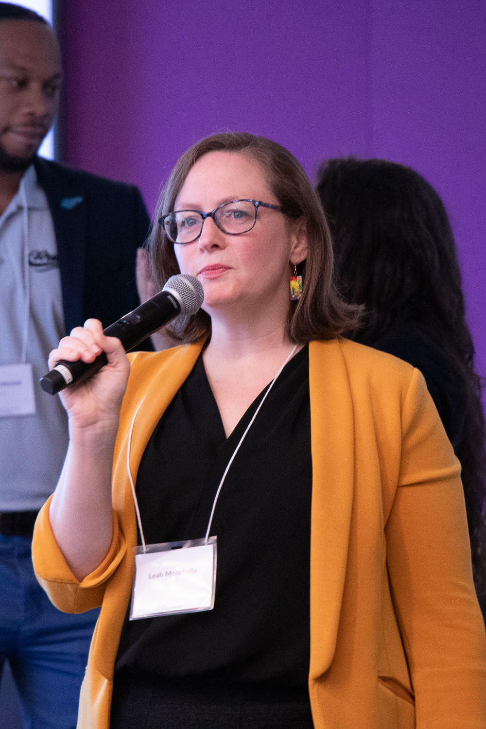 Leah Moschella speaking at a professional event