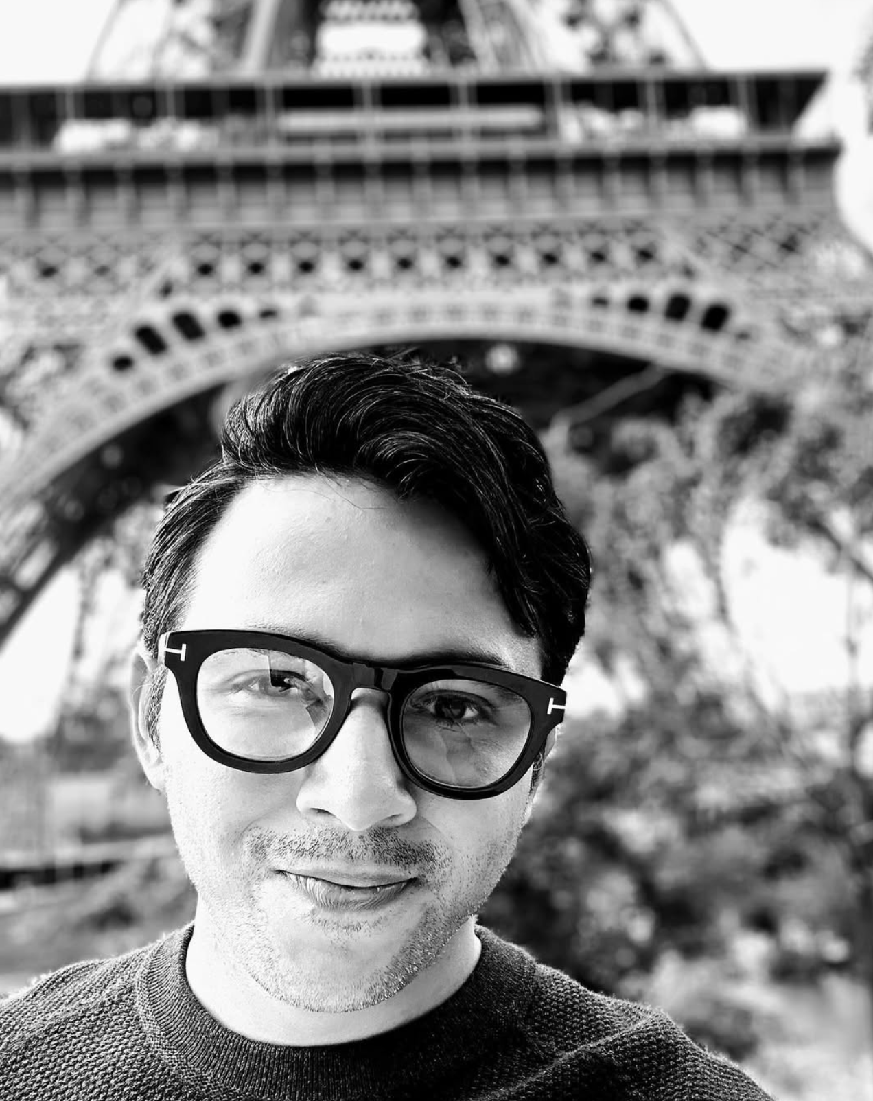Rushit Shah photographed in front of the Eiffel Tower, Paris.
