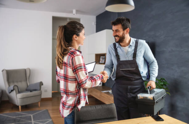 Plumber greeting homeowner