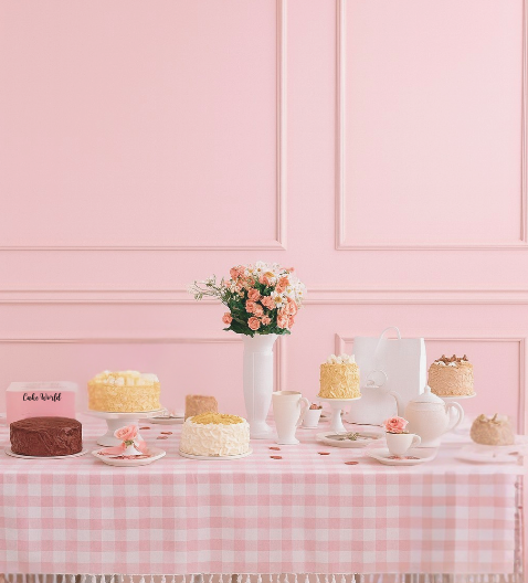 Cake World dessert display — pink tablescape
