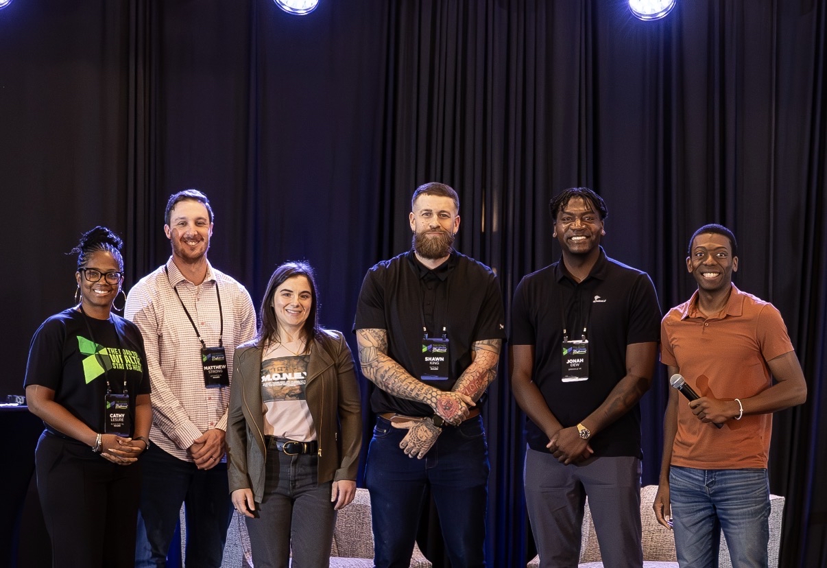 Liz with fellow practitioners on stage at an IBC conference
