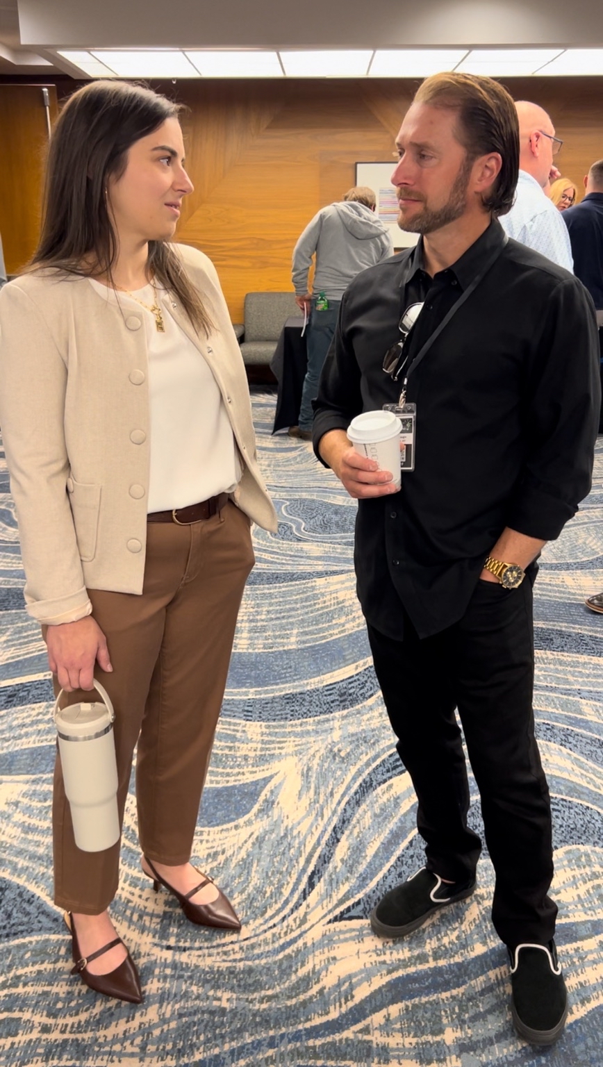 Liz in conversation with a fellow practitioner
